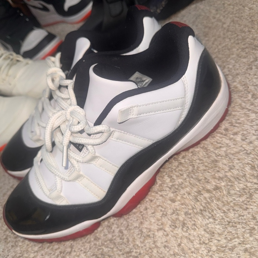 Black and White Sneakers with Red Soles